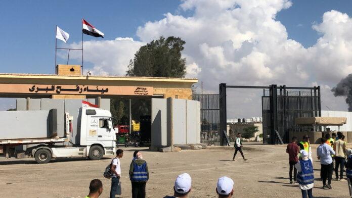 A blocked humanitarian aid convoy awaits outside Rafah border gate, Egypt