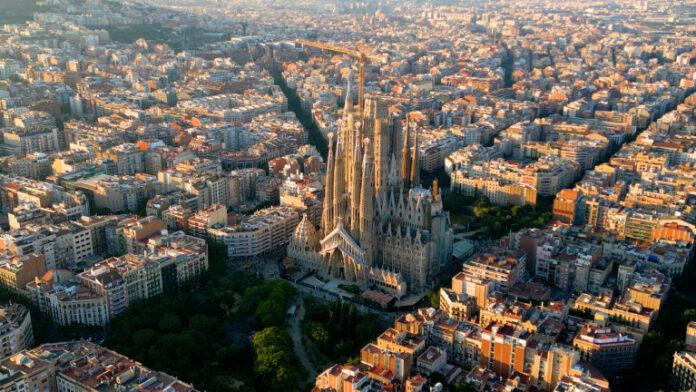 Barcelona Eixample residential district and famous Basilica Sagrada Familia at sunset Catalonia, Spain