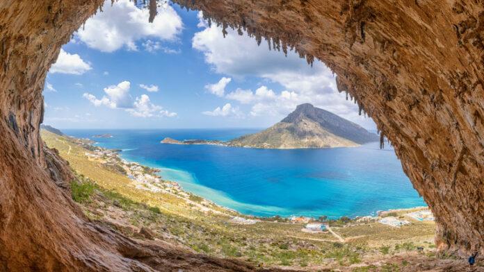 The famous "Grande Grotta", one of the most popular climbing fields of Kalymnos island, Greece In the background, Telendos island