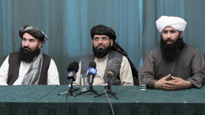 Taliban delegation members attend a news conference in Moscow