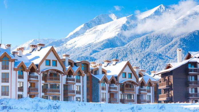 Houses and snow mountains panorama in bulgarian ski resort Bansko