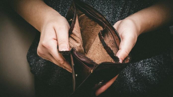 Old empty wallet in the hands Vintage empty purse in hands of women Poverty concept, Retirement Special toning