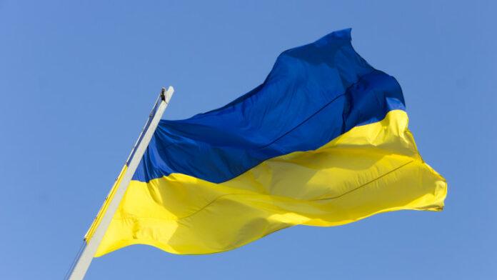 ukrainian national flag against the blue sky